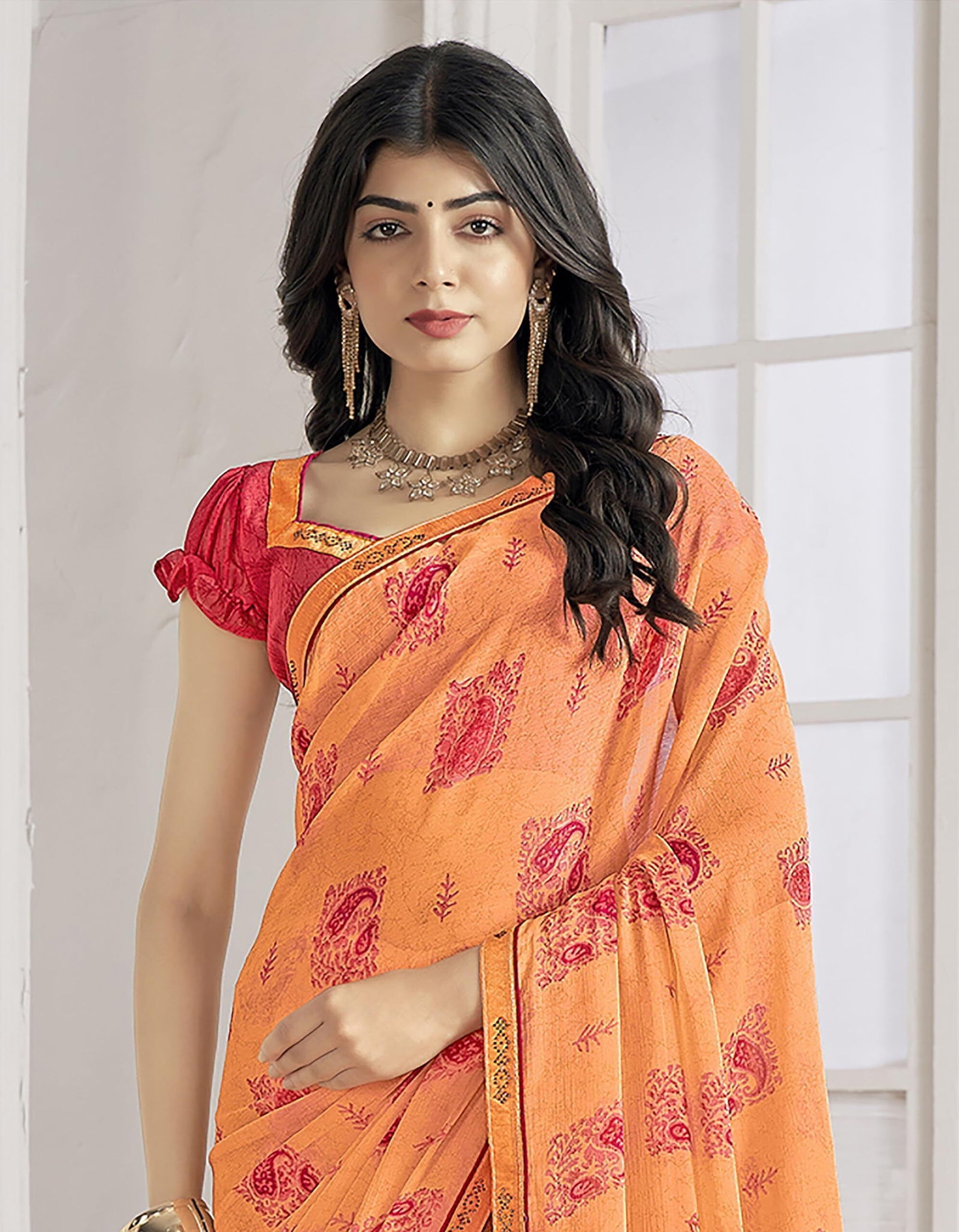 Trendy Self Printed Chiffon saree With All Over Fancy Printed Butta And Attached Siroski Lace (Orange)
