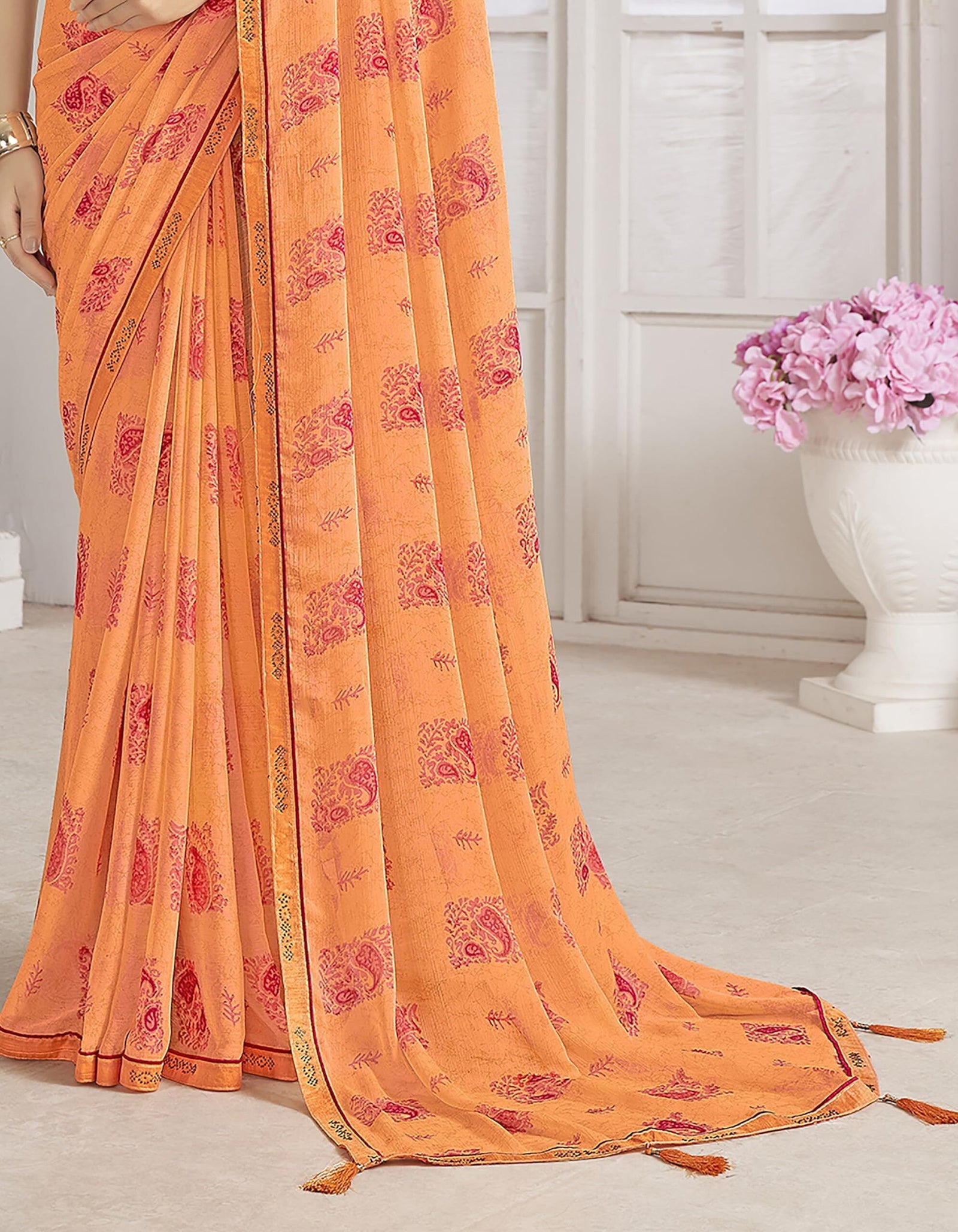 Trendy Self Printed Chiffon saree With All Over Fancy Printed Butta And Attached Siroski Lace (Orange)