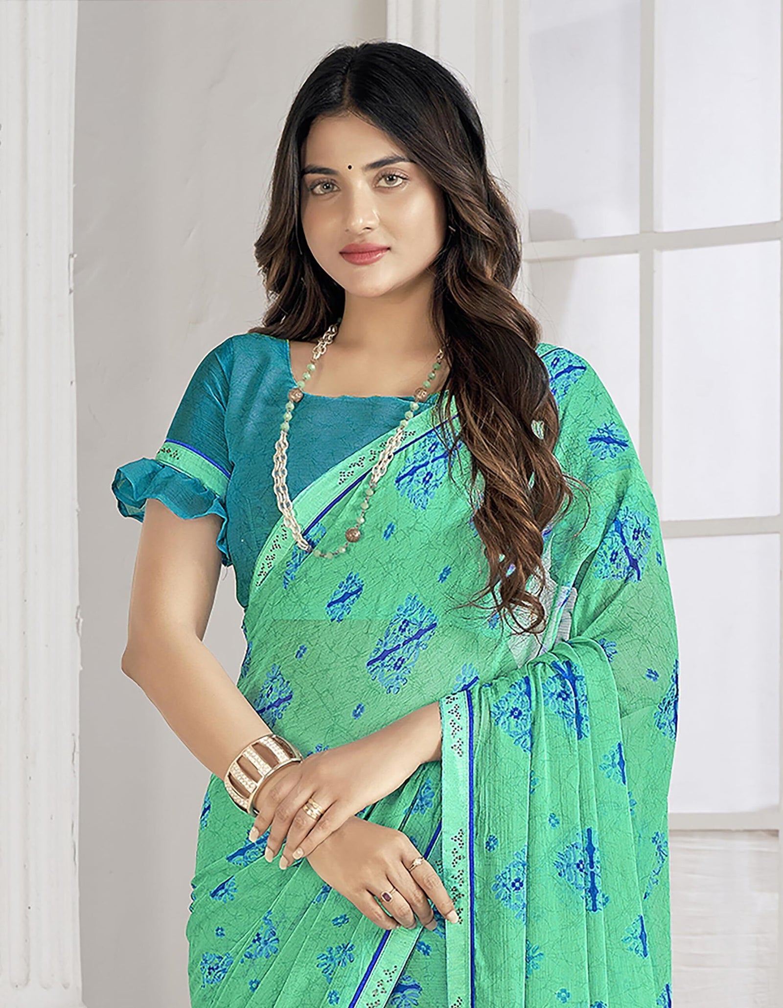 Trendy Self Printed Chiffon saree With All Over Fancy Printed Butta And Attached Siroski Lace (Green)