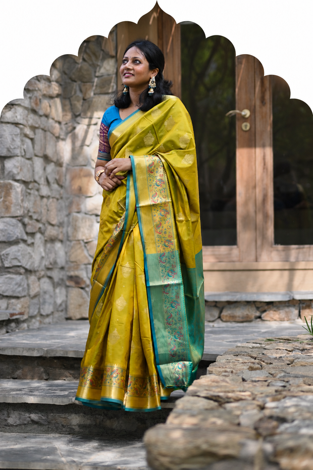 Woman in mustard yellow and green silk saree - Silk Sarees collection